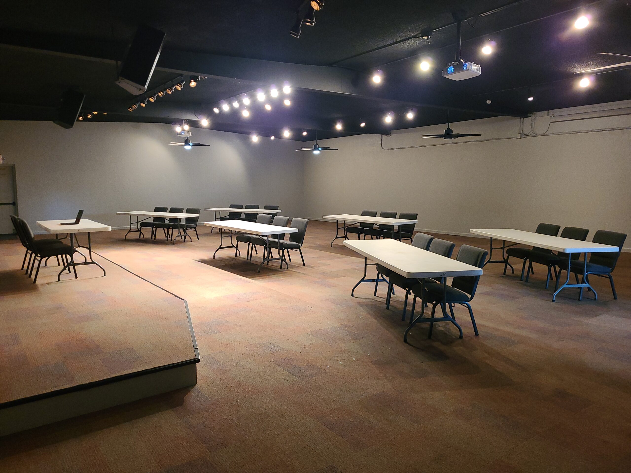 Wide shot photo of upstairs main hall, set up for business and training.